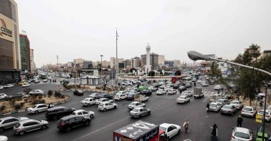 Commuters drive along a street, Tehran, Iran, Jan. 15, 2026. (AFP Photo)