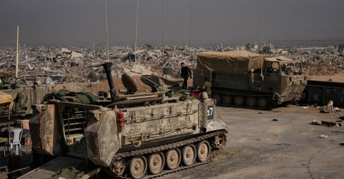 Israeli army vehicles are parked near buildings in ruins after Israeli military operations in the Shijaiya neighborhood of Gaza City, during an army-organized tour for journalists, Wednesday, Nov. 5, 2025. (AP File Photo)