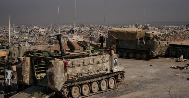 Israeli army vehicles are parked near buildings in ruins after Israeli military operations in the Shijaiya neighborhood of Gaza City, during an army-organized tour for journalists, Wednesday, Nov. 5, 2025. (AP File Photo)
