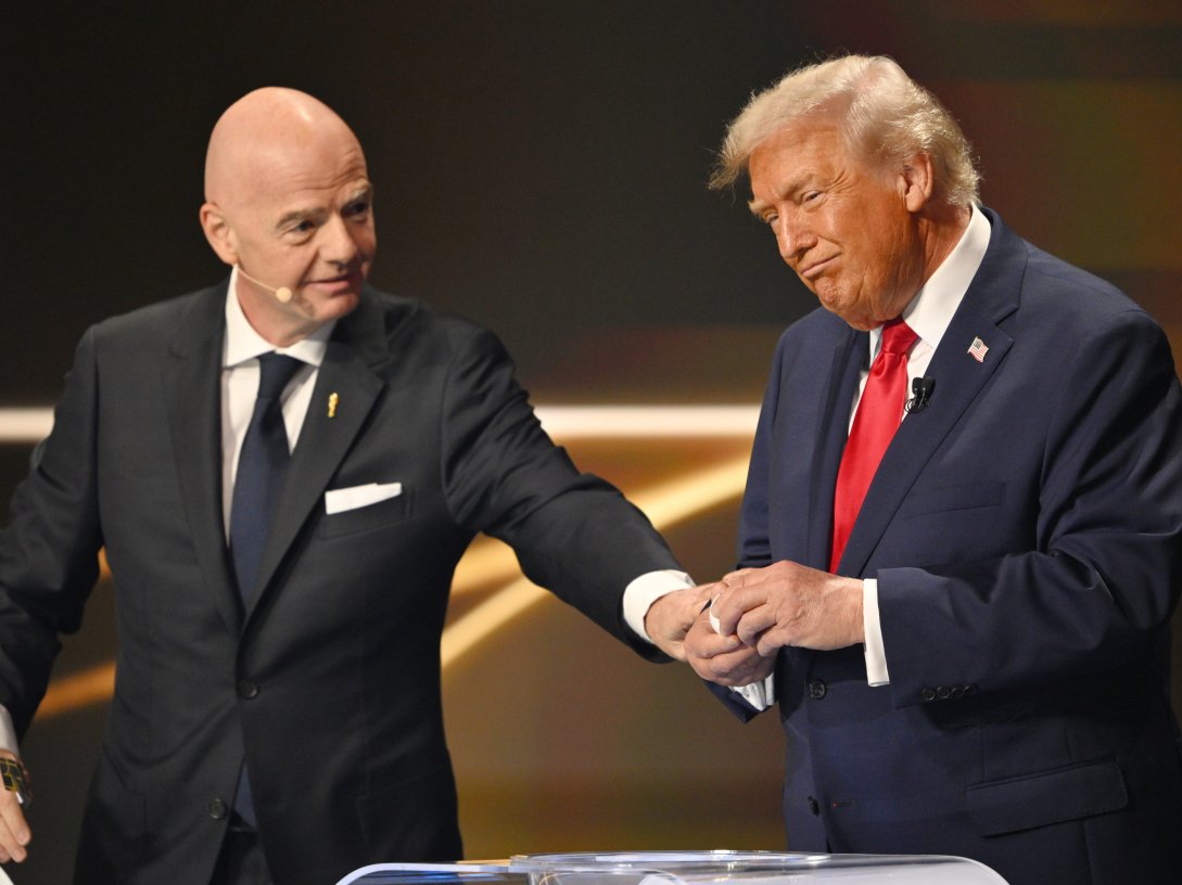 FIFA President Gianni Infantino pauses U.S. President Donald Trump during the draw for the 2026 football World Cup at the Kennedy Center in Washington, U.S., Dec. 5, 2025. (AP Photo)