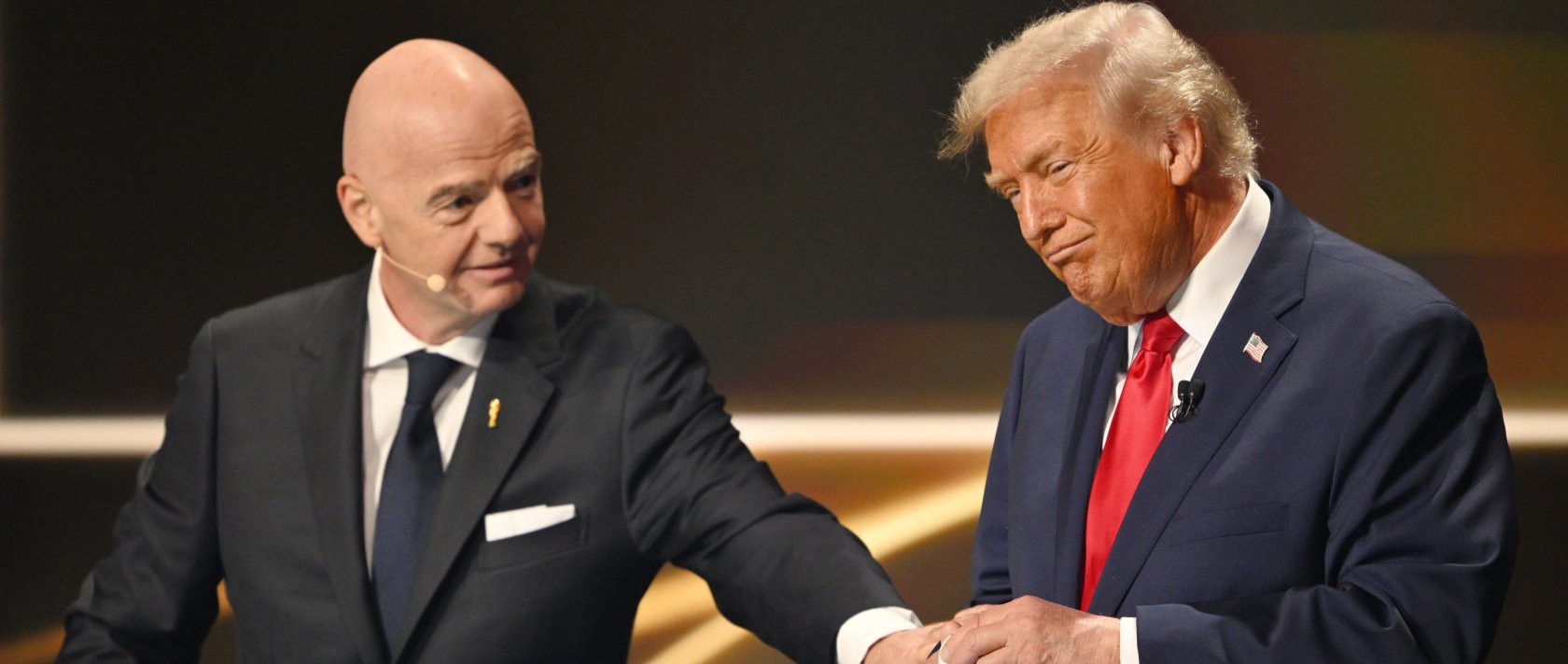 FIFA President Gianni Infantino pauses U.S. President Donald Trump during the draw for the 2026 football World Cup at the Kennedy Center in Washington, U.S., Dec. 5, 2025. (AP Photo)