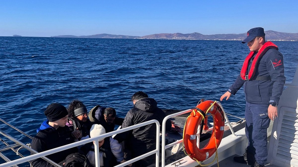 Turkish coast guard officers detain irregular migrants during operations off the coast of Izmir, Türkiye, Jan. 15, 2026. (DHA Photo)