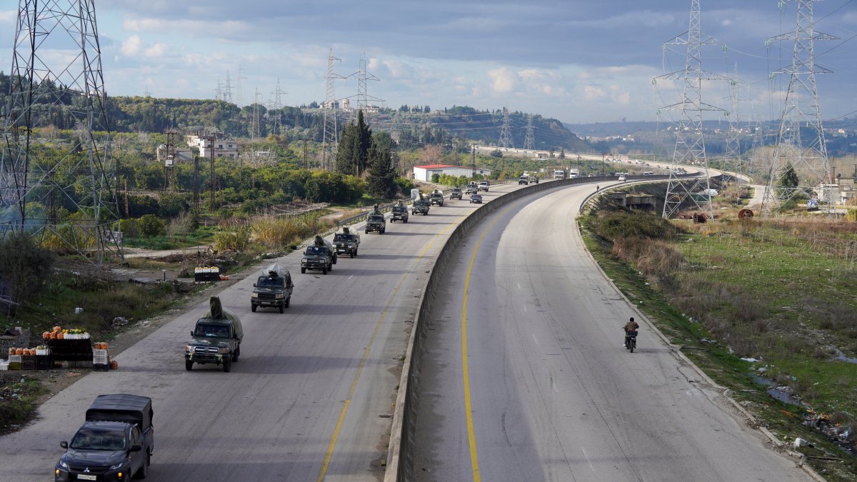 Military vehicles drive along a road as the last SDF militants left the Syrian city of Aleppo following a cease-fire deal that allowed evacuations after days of deadly clashes, in Latakia, Syria, Jan. 14, 2026. (Reuters Photo)