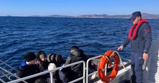 Turkish coast guard officers detain irregular migrants during operations off the coast of Izmir, Türkiye, Jan. 15, 2026. (DHA Photo)