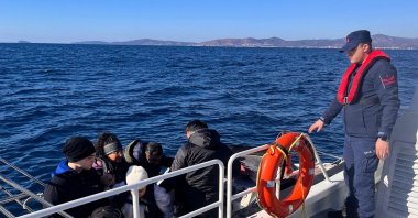 Turkish coast guard officers detain irregular migrants during operations off the coast of Izmir, Türkiye, Jan. 15, 2026. (DHA Photo)