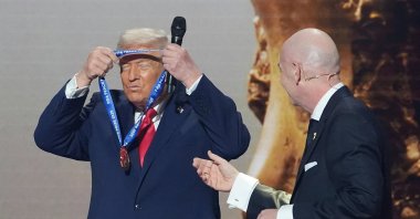 President Donald Trump (L) is presented with the inaugural FIFA Peace Prize by FIFA President Gianni Infantino during the 2026 FIFA World Cup draw at the Kennedy Center, Washington, U.S., Dec. 5, 2025. (AP Photo)