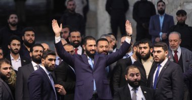 Syrian President Ahmed al-Sharaa waves to the crowd at the gate of Aleppo’s Citadel, Nov. 29, 2025. (AFP File Photo)