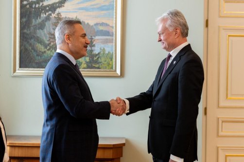 Foreign Minister Hakan Fidan (L) is received by Lithuanian President Gitanas Nauseda (R), Vilnius, Lithuania, Jan 16, 2025. (AA Photo)