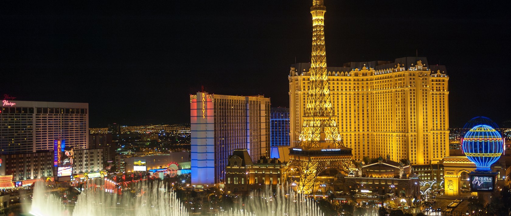 Bellagio Fountains and Paris Las Vegas on the Las Vegas Strip at night in Las Vegas, Nevada, U.S., April 7, 2011. (Shutterstock Photo)