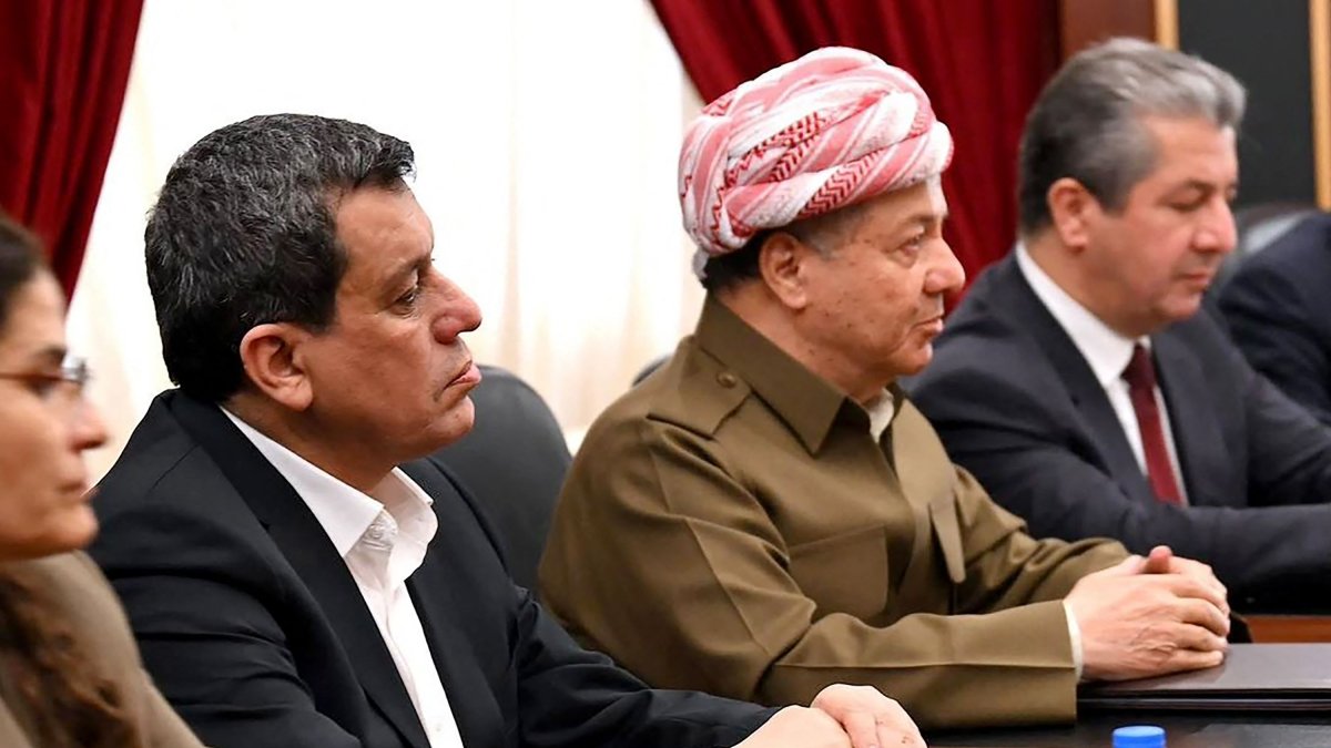 YPG ringleader Ferhat Abdi Şahin (L) sits next to Iraqi Kurdish politician Massoud Barzani (2nd L) during a meeting, Irbil, Iraq, Jan. 17, 2026. (AFP Photo)