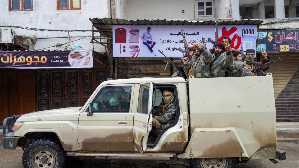 Syrian army personnel travel in a military vehicle deployed inside the city of Tabqa, Syria, Jan. 18, 2026. (Reuters Photo)