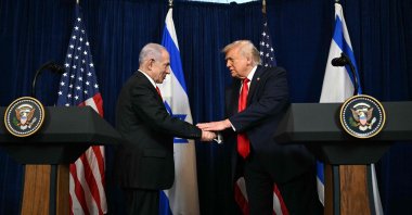 U.S. President Donald Trump (R) and Israeli Prime Minister Benjamin Netanyahu shake hands as they arrive to speak to journalists during a joint press conference, in Palm Beach, Florida, U.S., Dec. 29, 2025. (AFP Photo)