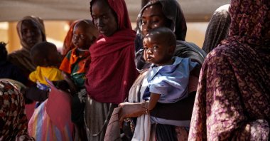 A handout photograph, shot in January 2024, shows women and babies at the Zamzam displacement camp, close to El Fasher in North Darfur, Sudan. (AFP Photo)