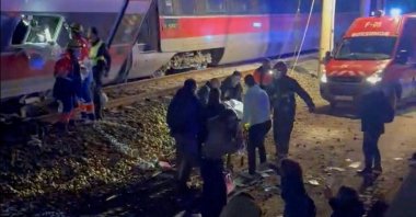 First responders search through wreckage after two high-speed trains derailed in Adamuz, near Cordoba, Spain, Jan. 18, 2026. (Reuters Photo)
