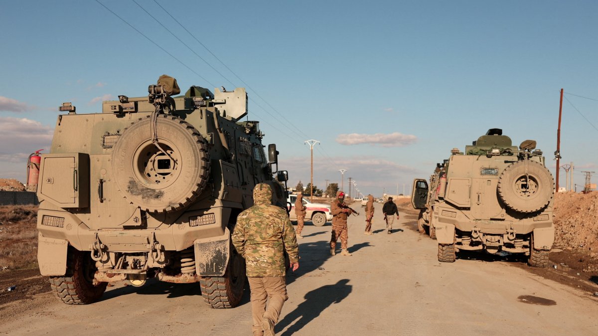 Military members gather near Raqqa prison, where the Syrian army is besieging SDF members after the army took control of the city of Raqqa, Syria, Jan. 19, 2026. (Reuters Photo)