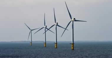 Wind mills farm out in the North Sea. (Shutterstock Photo)