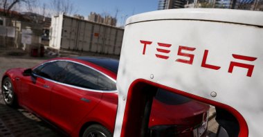 A Tesla car charges at a Supercharger charging station of the electric vehicle (EV) maker in Beijing, China, March 24, 2025. (Reuters Photo)