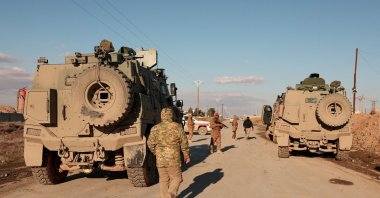 Military members gather near Raqqa prison, where the Syrian army is besieging SDF members after the army took control of the city of Raqqa, Syria, Jan. 19, 2026. (Reuters Photo)