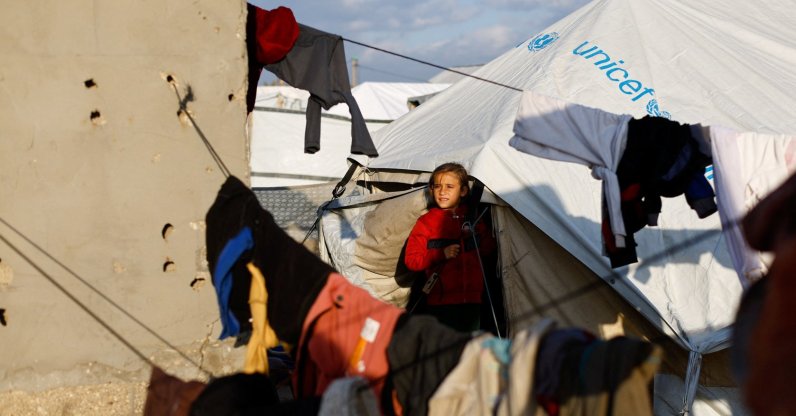 A child looks out from a tent as displaced Palestinians shelter in a tent camp in Deir al-Balah, central Gaza Strip, Jan. 19, 2026. (Reuters Photo)