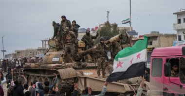 People celebrate the entry of Syrian army forces into the Deir Hafer area after the withdrawal of the YPG, Deir Hafer, eastern Aleppo countryside, Syria, Jan. 17, 2026. (EPA Photo)