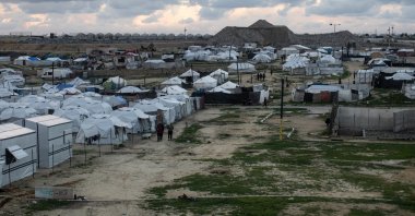 Displaced Palestinians stand near their tents in a temporary camp set up in the city of Khan Younis, southern Gaza Strip, Palestine, Jan. 18, 2026. (EPA Photo)