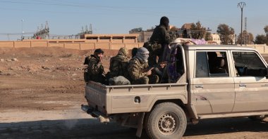 Syrian army soldiers patrol on their vehicle in the city of al-Shadadi, located in the countryside of Hassakeh, Syria, Jan. 20, 2026. (EPA Photo)