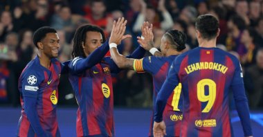 Barcelona's Jules Kounde (2nd L) celebrates with teammates after scoring his side's second goal during the Champions League opening phase match against Eintracht Frankfurt, Barcelona, Spain, Dec. 9, 2025. (AP Photo)
