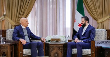 This handout picture released by the Syrian Presidency's Telegram page, shows Syria's President Ahmed al-Sharaa meeting with U.S. envoy Tom Barrack at the Presidential Palace, Damascus, Syria, Jan. 18, 2026. (Syrian Presidency Telegram Page Handout Photo via AFP)