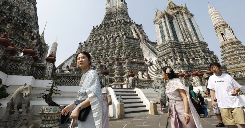Tourists dressed in traditional Thai attire visit the Temple of Dawn (Wat Arun), Bangkok, Thailand, Jan. 19, 2026. (EPA Photo)