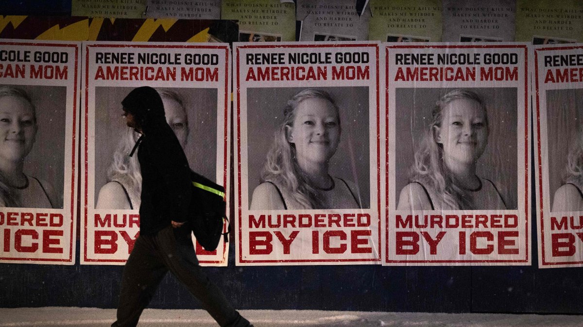 A man walks by a series of posters memorializing Renee Good, after an ICE agent fatally shot Good in her car, Minneapolis, Minnesota, U.S., Jan. 16, 2026. (AFP Photo)