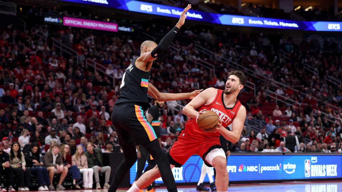 Houston Rockets' Alperen Şengün (R) shoots the ball during the first quarter of the game against San Antonio Spurs' Victor Wembanyama at Toyota Center, Houston, U.S., Jan. 20, 2026. (AFP Photo)