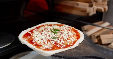 A pizza is ready to go into the oven, Rome, Italy, Jan. 13, 2025. (AA Photo)