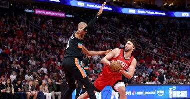 Houston Rockets' Alperen Şengün (R) shoots the ball during the first quarter of the game against San Antonio Spurs' Victor Wembanyama at Toyota Center, Houston, U.S., Jan. 20, 2026. (AFP Photo)