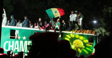 Senegal's Football Team players celebrate winning the Africa Cup of Nations (AFCON) atop an open bus during a trophy parade, Dakar, Senegal, Jan. 20, 2026. (AFP Photo)