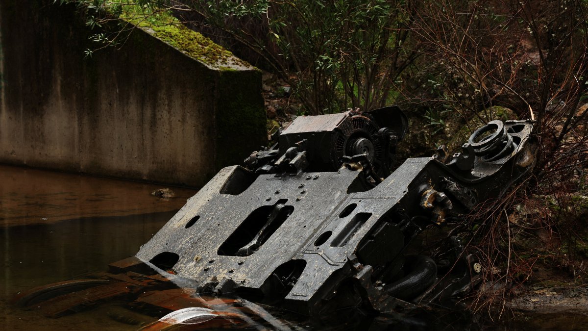 A metal part lies in water near the site of a deadly derailment of two high-speed trains near Adamuz, Cordoba, Spain, Jan. 21, 2026. (Reuters Photo)