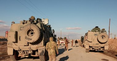 Military members gather near Raqqa prison, where the Syrian army is besieging YPG members, Raqqa, Syria, Jan. 19, 2026. (Reuters Photo)