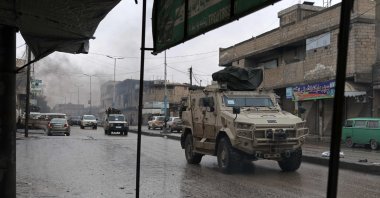 Syrian army personnel patrol the streets of Tabqa, on the southwestern banks of the Euphrates, Raqqa province, Syria, Jan. 18, 2026. (AFP Photo)