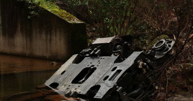 A metal part lies in water near the site of a deadly derailment of two high-speed trains near Adamuz, Cordoba, Spain, Jan. 21, 2026. (Reuters Photo)