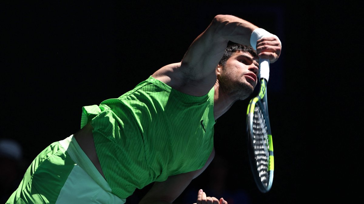 Spain's Carlos Alcaraz serves to France's Corentin Moutet during their men's singles match on day six of the Australian Open tennis tournament, Melbourne, Australia, Jan. 23, 2026. (AFP Photo)