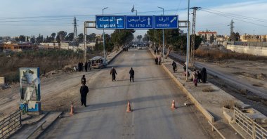 An aerial photograph shows people walking along a street toward northeastern Raqqa, Syria, Jan. 21, 2026. (AFP Photo)