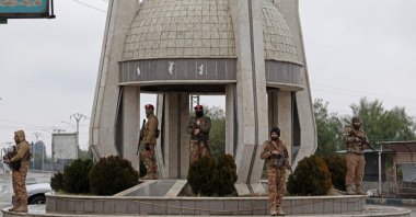Syrian army personnel stand guard along a street in Tabqa, after the YPG terrorists withdrew, on the southwestern banks of the Euphrates, Raqqa province, Syria, Jan. 18, 2026. (AFP Photo)