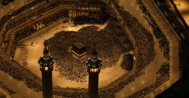 This aerial view shows the Grand Mosque complex as Muslims perform the evening prayer around the Ka'aba, Islam's holiest shrine, on June 6, 2025. (AFP Photo)