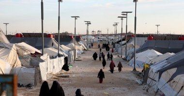 Women and children, relatives of suspected Daesh terrorists, are seen at Al-Hol camp in the desert region of Syria's northeastern Hassakeh province, Jan. 21, 2026. (AFP Photo)