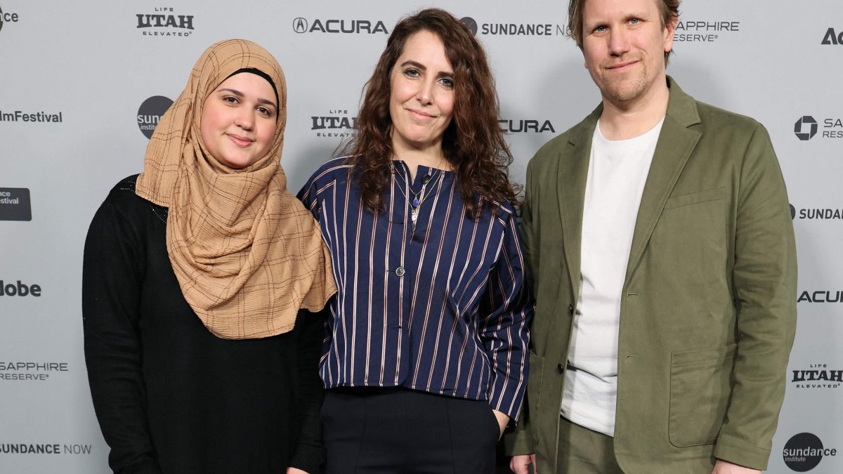 (L-R) Isra’a, Itab Azzam and Jack MacInnes attend the "One In A Million" Premiere during the 2026 Sundance Film Festival at The Yarrow Theatre in Park City, Utah, U.S., Jan. 23, 2026. (AFP Photo)