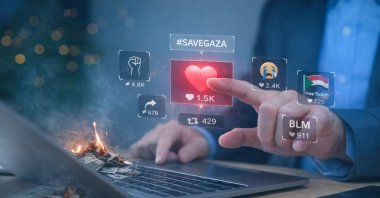 "Clicktivism thrives because it demands nothing. A post communicates moral alignment while avoiding cost." (Daily Sabah Illustration)