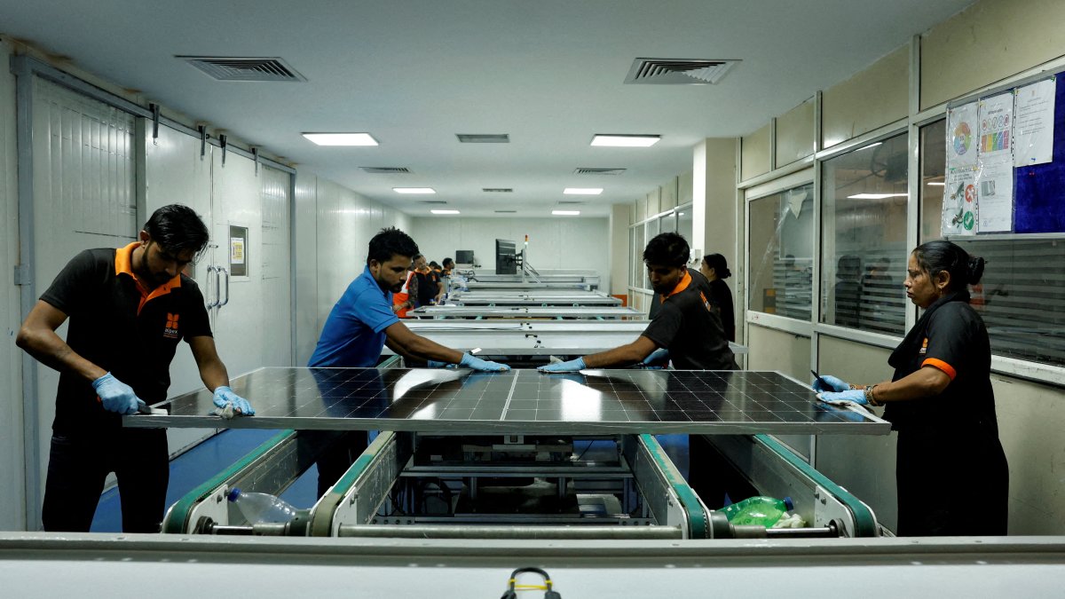 Technicians work on the assembly line in a solar manufacturing hub in Greater Noida, on the outskirts of New Delhi, India, Oct. 23, 2024. (Reuters Photo)