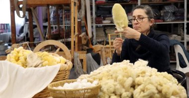 Emel Duman, a prominent master of sericulture and weaving, works in her workshop in Hatay, southern Türkiye, Jan. 24, 2026. (AA Photo)