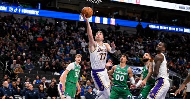 Los Angeles Lakers guard Luka Doncic (77) drives to the basket past Dallas Mavericks forward Cooper Flagg (32) and guard Max Christie (00), Dallas, Texas, U.S., Jan 24, 2026. (Imagn Images Photo via Reuters)