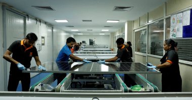 Technicians work on the assembly line in a solar manufacturing hub in Greater Noida, on the outskirts of New Delhi, India, Oct. 23, 2024. (Reuters Photo)