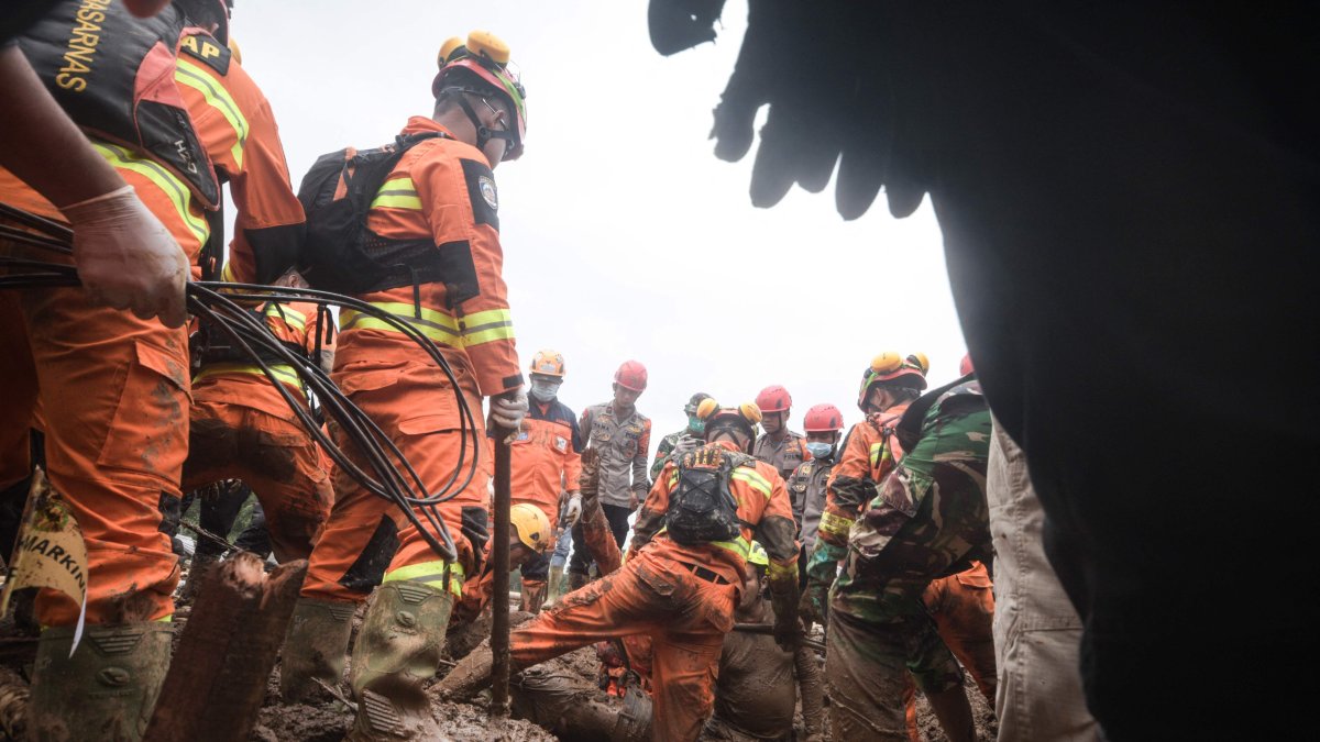 17 dead, dozens missing after landslide buries village in Indonesia